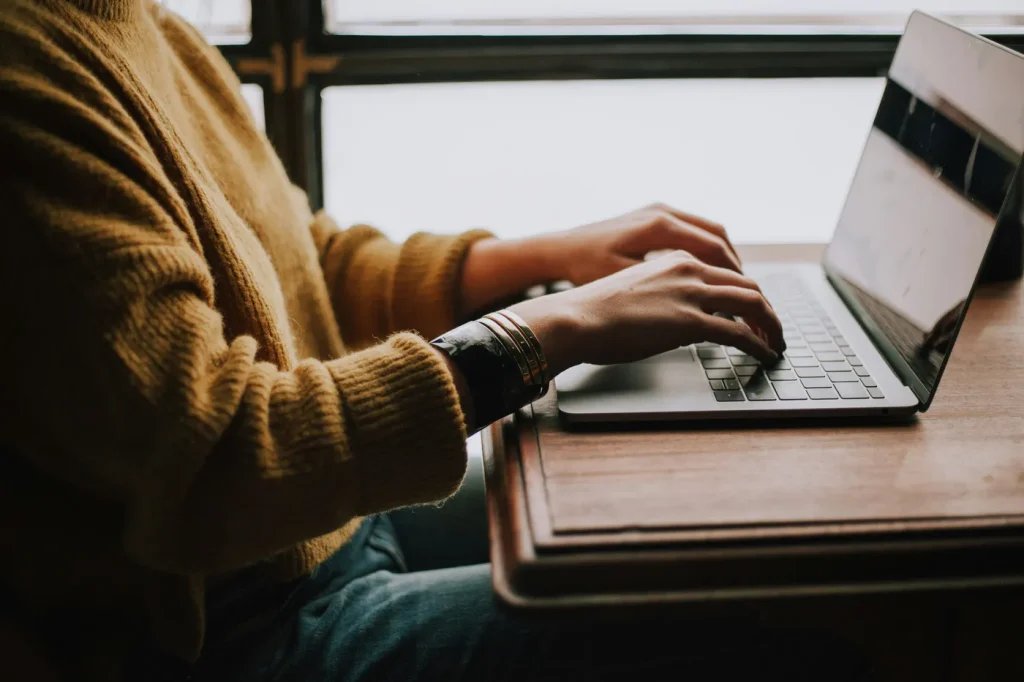 man sitting in front of laptop