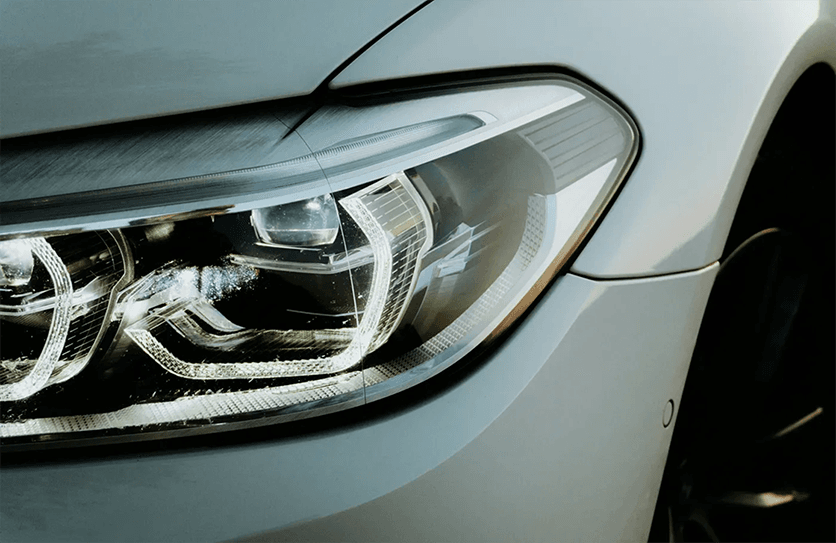 Front light of a grey car