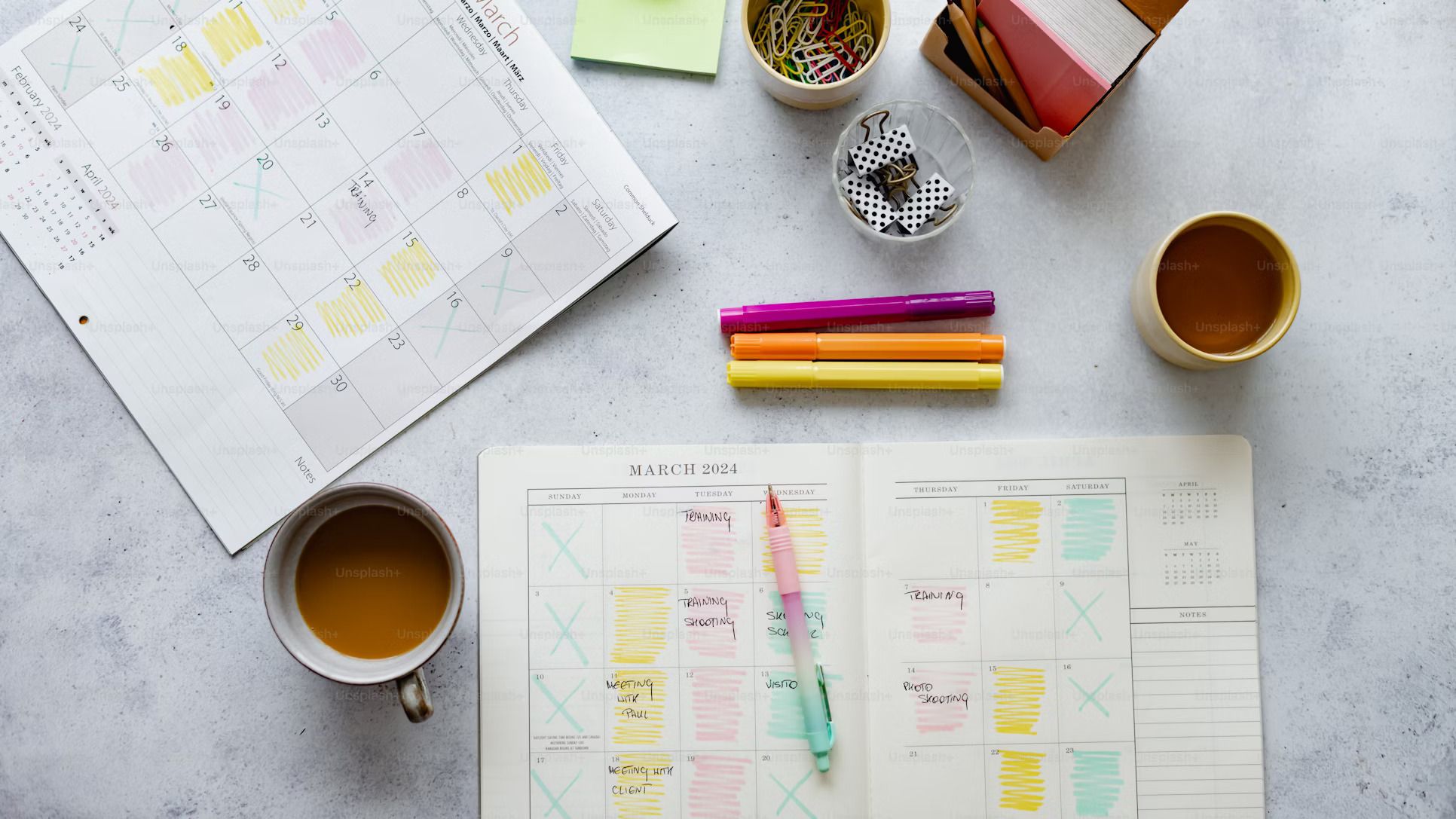 Planning calendar and coffee on a desk